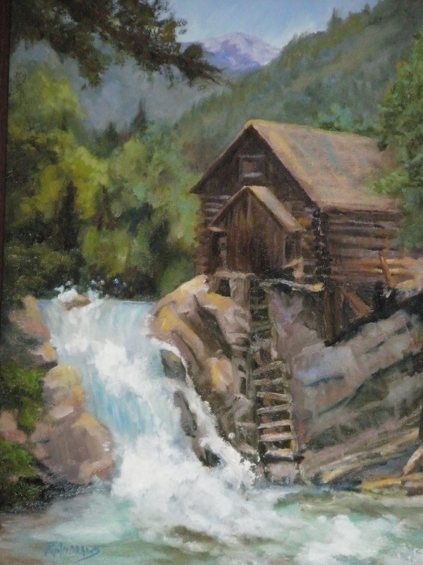 old mill next to waterfall